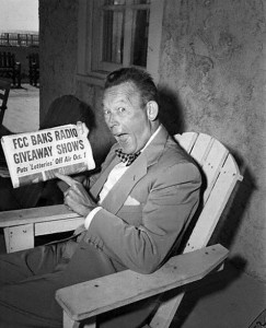 Fred Allen Holding a Newspaper